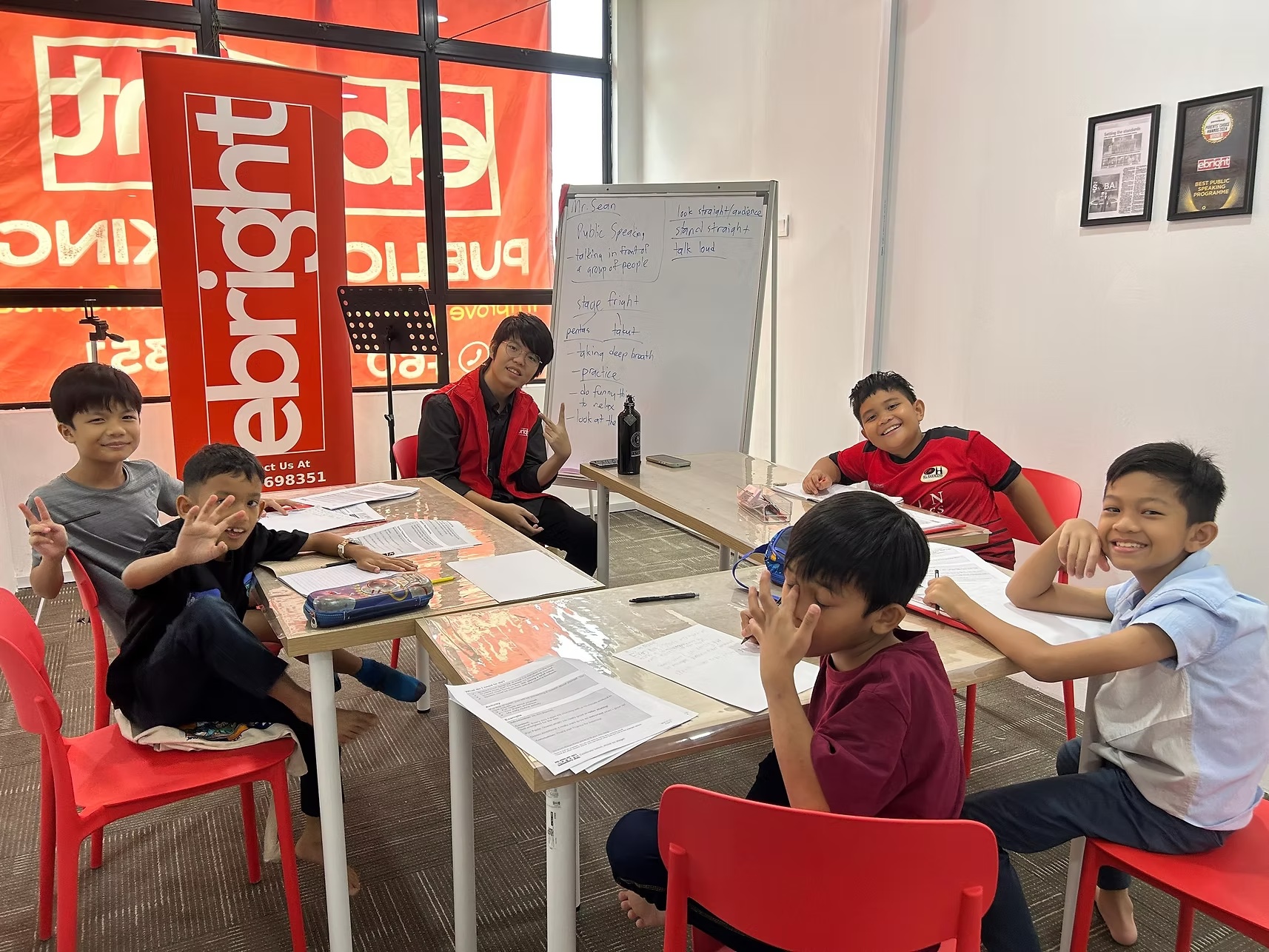 Instructor leading a classroom speaking activity