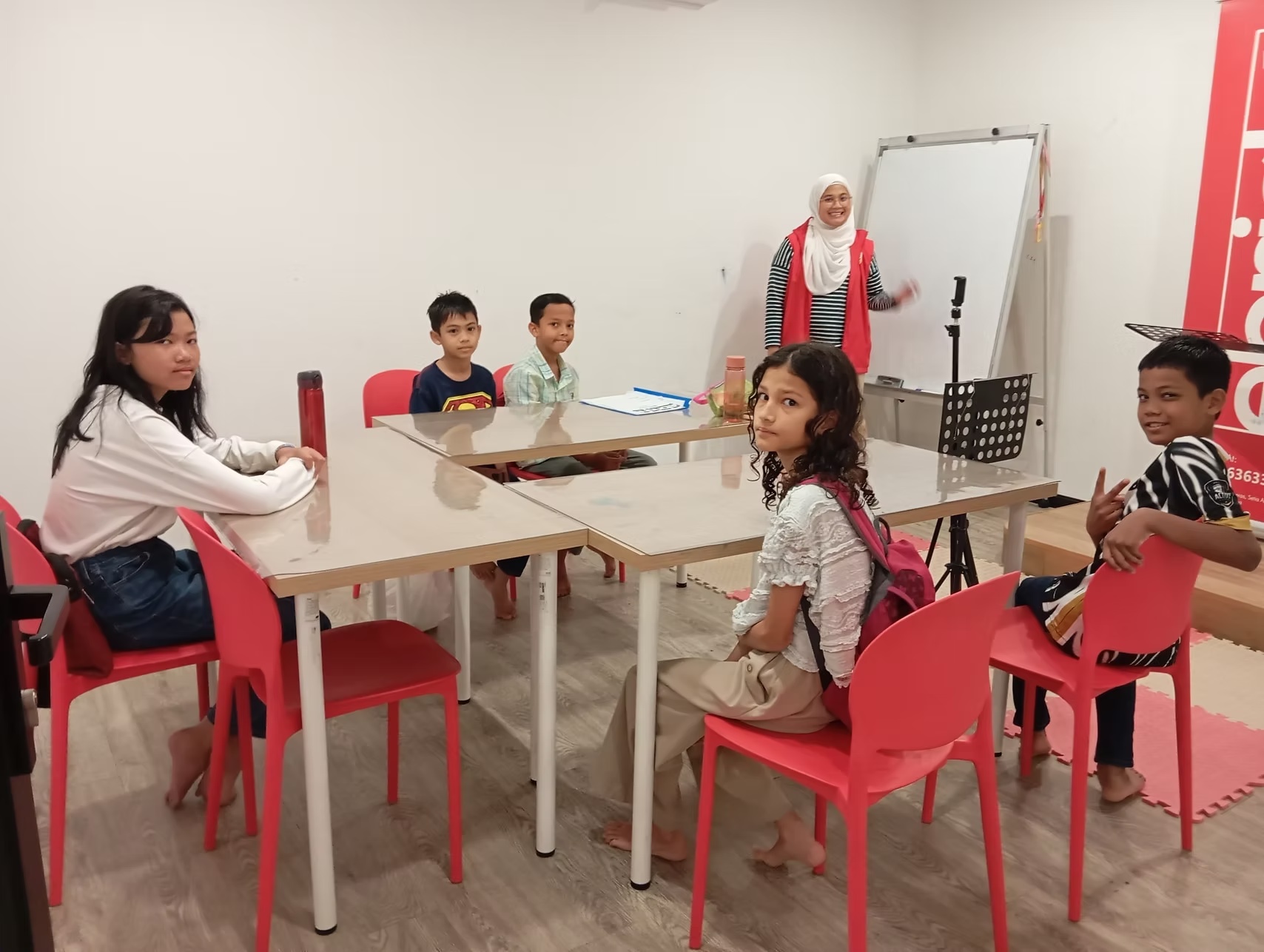 Student presenting beside an Ebright display