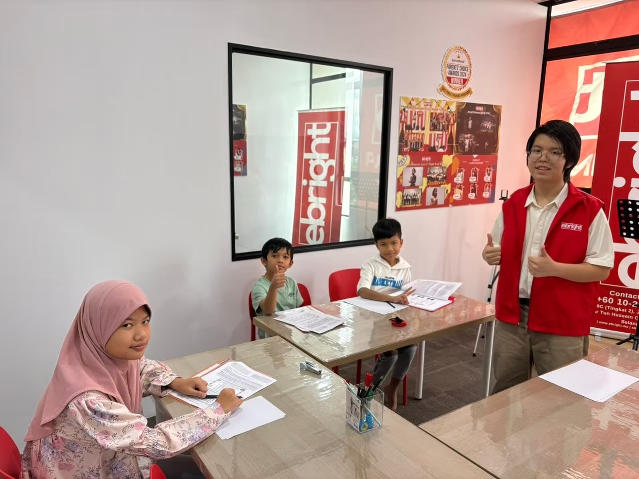 Student standing and participating in a speaking exercise